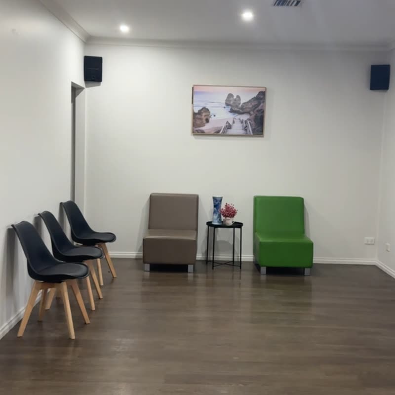 The waiting room, with chairs and armchairs along the walls